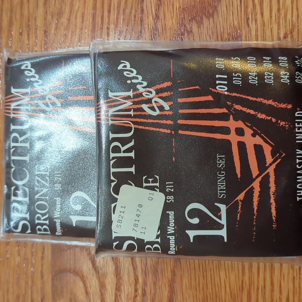 Spectrum bronze round wound . 001 12 string guitar strings set , two package NWT